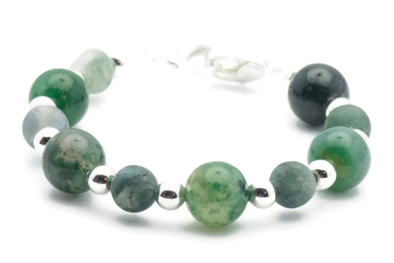 May include: A green agate gemstone bracelet with silver beads and a silver clasp.