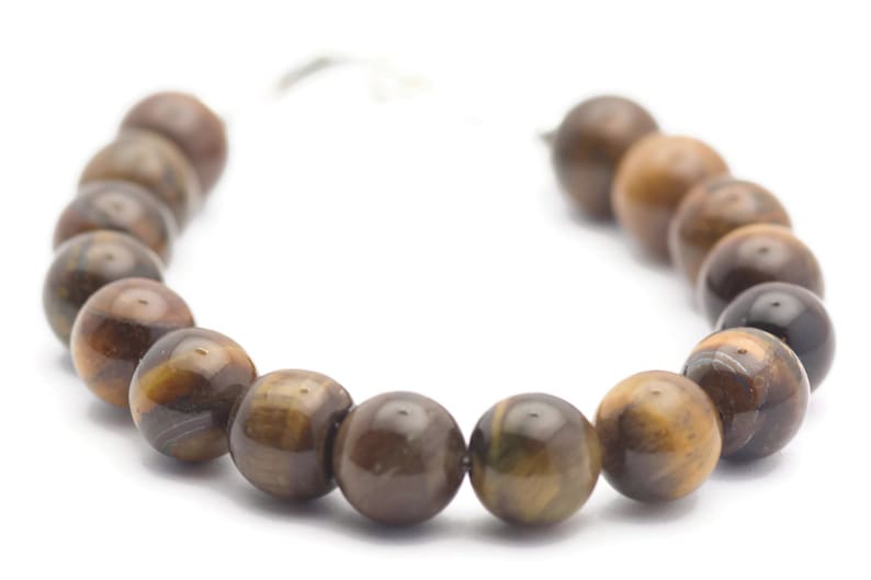 Op de afbeelding: Een bruine tijgeroog-armband met ronde kralen.