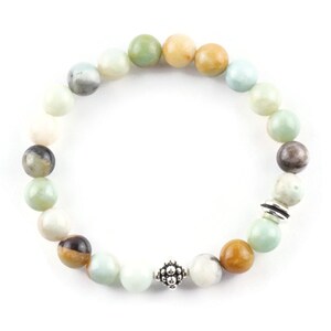 Black Gold Amazonite Genuine Gemstone Stretch Bracelet on white background. Amazonite beads are multicolor earth-tones. Center bead is a silver Bali style bead.