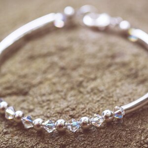 April Diamond Swarovski Crystal Birth Month Sterling Silver Plated Bracelet on stone