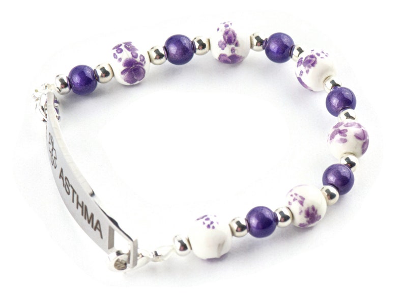 May include: A purple and white beaded bracelet with a silver medical ID tag that reads "ASTHMA".