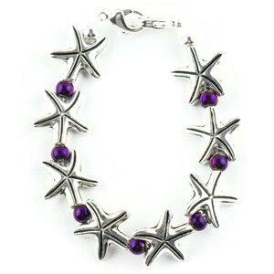 May include: A silver bracelet with a series of starfish charms and purple beads.