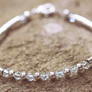 December Light Azore Swarovski Crystal Birth Month Sterling Silver Plated Bracelet on stone