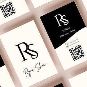 May include: Business cards with a minimalist design. The cards feature a black and white color scheme with the initials "RS" in a stylized font. The cards include contact information and QR codes for easy access.