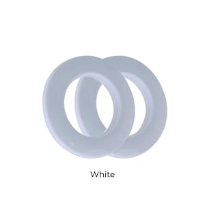 May include: Two white plastic curtain rings.