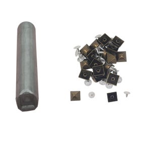 May include: A set of pyramid-shaped metal studs with a tool for setting them. The studs are a mix of gold and silver tones.