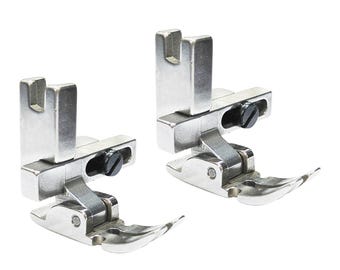 May include: Two silver-colored metal sewing machine presser feet with a hinged design. Each foot features a vertical shank with a U-shaped top notch, a horizontal adjustment slot with a black screw, and a curved, smooth base plate for fabric.