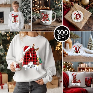 May include: A collection of Christmas-themed items featuring a red and black buffalo plaid pattern. Includes a sweatshirt, mug, ornament, and pillow, each with a letter, Santa hat, and reindeer antlers. The sweatshirt and mug have a name below the letter.