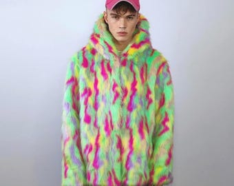 May include: A vibrant, faux fur hooded jacket in neon green, pink, yellow, and purple. The jacket has a bold, abstract pattern and a relaxed fit. A pink baseball cap with the word "Diesel" is worn on the head.