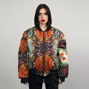 May include: A colorful bomber jacket with a psychedelic print featuring abstract shapes, flowers, and geometric patterns. The jacket has a zipper closure and a black collar.