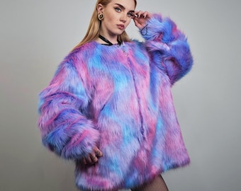 May include: A vibrant, oversized faux fur coat in a tie-dye pattern of blue, pink, and purple. The coat has long sleeves and a button closure. The soft, fluffy texture and bold colors make it a statement piece.