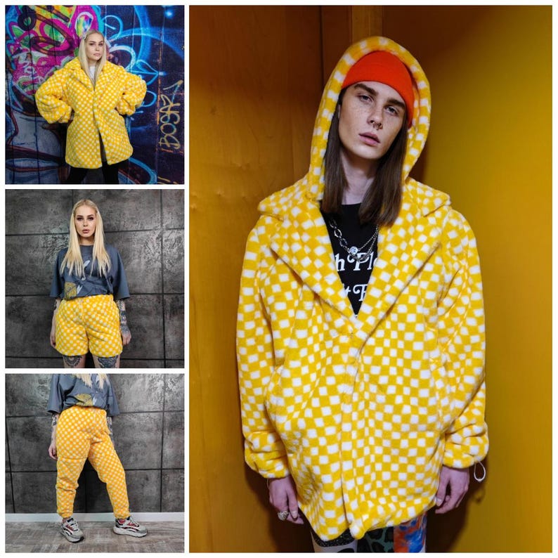 May include: A yellow and white checked fleece coat with a hood. The image also shows matching shorts and trousers. The coat has a classic collar and large pockets. The outfit is a bold fashion statement.
