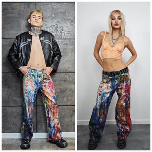 Express your bold style with these unisex paint splatter jeans, featuring vibrant colors and an edgy artistic vibe. Perfect for streetwear fans, skaters, festival goers, and creatives who love standout fashion. These jeans blend comfort with individuality, making them ideal for concerts, parties, raves, or everyday wear. A must-have for Y2K, grunge, and alternative fashion lovers seeking a unique wardrobe staple that turns heads and sets trends.