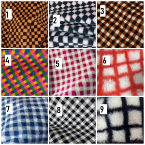 May include: Nine fabric samples with different checkered designs. The colour schemes include orange and black, black and white, brown and white, and a rainbow pattern. The fabrics have a soft, textured appearance, suitable for various textile projects.