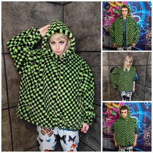 May include: A neon green and black checkered hooded jacket with a zip fastening. The jacket is made of a fuzzy material. The model is wearing white trousers with butterfly graphics. The image is a collage of multiple shots.