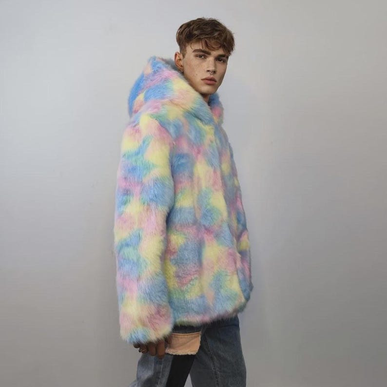 This coat is wearable bliss and pure dopamine dressing! The fluffy tie-dye fleece provides maximum winter warmth and a plush, shaggy texture. Its pastel rainbow blend is ideal for a "Doll Core" aesthetic or standing out on the Playa. This gender-fluid overcoat is your go-to for unique festival wear, blending the comfort of a puffer with the spirit of a raver bomber. The essential pink blue layer for your most whimsical going out looks.