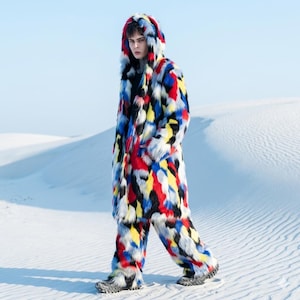 May include: A set of three ceramic mugs with a speckled, matte finish. The mugs are in shades of cream, light gray, and dark gray. Each mug has a simple, minimalist design and a rounded handle.