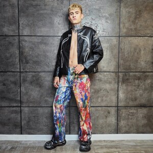 Express your bold style with these unisex paint splatter jeans, featuring vibrant colors and an edgy artistic vibe. Perfect for streetwear fans, skaters, festival goers, and creatives who love standout fashion. These jeans blend comfort with individuality, making them ideal for concerts, parties, raves, or everyday wear. A must-have for Y2K, grunge, and alternative fashion lovers seeking a unique wardrobe staple that turns heads and sets trends.