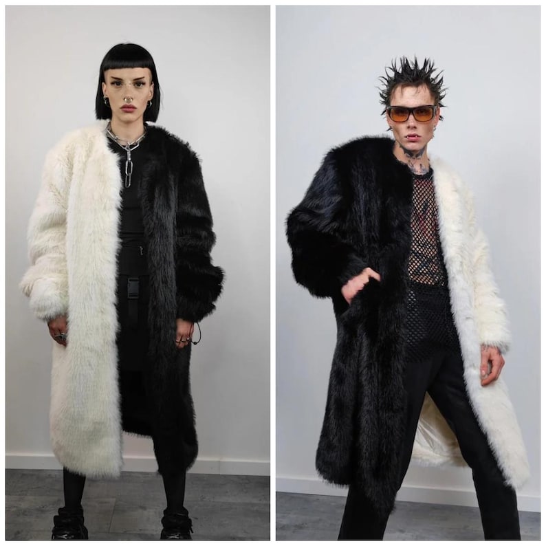 May include: Two long faux fur coats, one black and white, the other white and black. The coats are split down the middle with one side black and the other white. The coats are worn by two people.