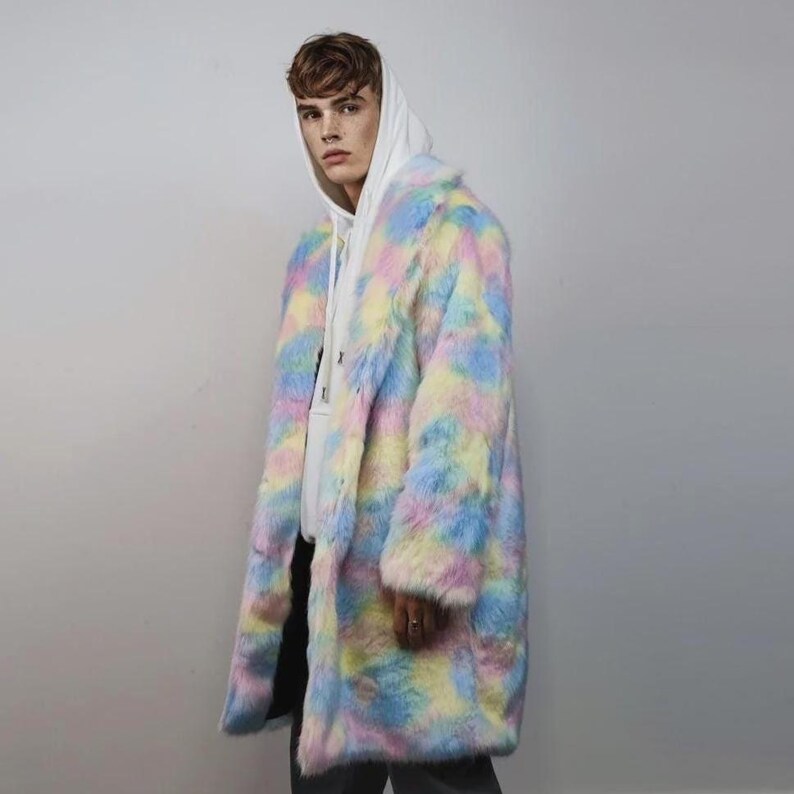 Step into a fantasy with this spectacular Pastel Faux Fur Long Unicorn Coat! The voluminous, fluffy fur features a magical, tie-dye rainbow of soft pinks, blues, and yellows. The dramatic long trench silhouette and oversized fit make it perfect for commanding attention. This unisex piece is your essential layer for Burner events, raver nights, and festival days. It’s the ultimate fluffy fleece jacket for a bold, maximalist statement.
