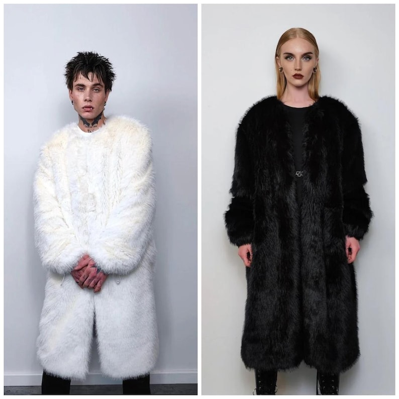 May include: Two full-length coats. One is white, the other is black. Both coats have a long, shaggy fur texture. The white coat is worn by a person with dark hair and tattoos. The black coat is worn by a person with blonde hair and dark lipstick.