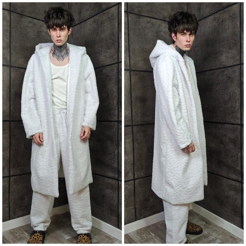 This UV Reactive Parka is the ultimate Cyber Rave statement. Designed for high-impact visibility at warehouse parties and outdoor Festivals, the Bioluminescent effect ensures you stand out in the dark. It features a deep hood for that mysterious "afterhours" look. Pro Tip: Keep the glow strong by standing near a blacklight for a few minutes to "recharge" your brightness throughout the night. Essential gear for Hardstyle, Industrial, and Trance fans.