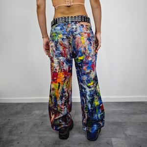 Express your bold style with these unisex paint splatter jeans, featuring vibrant colors and an edgy artistic vibe. Perfect for streetwear fans, skaters, festival goers, and creatives who love standout fashion. These jeans blend comfort with individuality, making them ideal for concerts, parties, raves, or everyday wear. A must-have for Y2K, grunge, and alternative fashion lovers seeking a unique wardrobe staple that turns heads and sets trends.