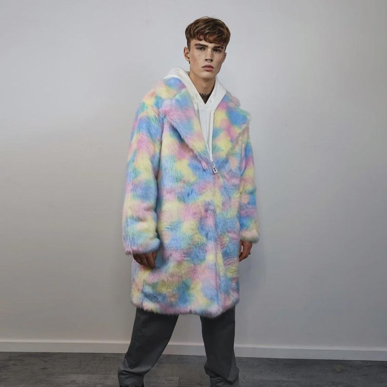 Step into a fantasy with this spectacular Pastel Faux Fur Long Unicorn Coat! The voluminous, fluffy fur features a magical, tie-dye rainbow of soft pinks, blues, and yellows. The dramatic long trench silhouette and oversized fit make it perfect for commanding attention. This unisex piece is your essential layer for Burner events, raver nights, and festival days. It’s the ultimate fluffy fleece jacket for a bold, maximalist statement.