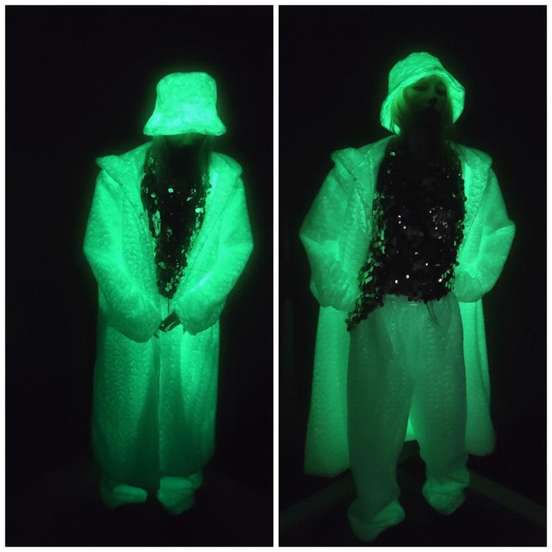 This UV Reactive Parka is the ultimate Cyber Rave statement. Designed for high-impact visibility at warehouse parties and outdoor Festivals, the Bioluminescent effect ensures you stand out in the dark. It features a deep hood for that mysterious "afterhours" look. Pro Tip: Keep the glow strong by standing near a blacklight for a few minutes to "recharge" your brightness throughout the night. Essential gear for Hardstyle, Industrial, and Trance fans.