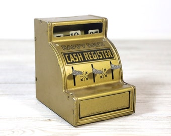 Gold With Black Print and Designs With Red Bottom Vintage Toy Cash Register Black and Red Plastic Handle Push Buttons to Raise Numbers.