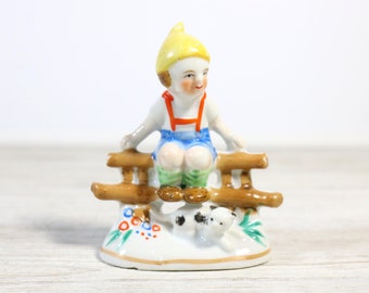Vintage Ceramic Japan Figurine Boy on Fence with a Cat