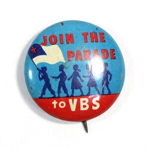 May include: A blue and red button with a white cross flag and the text "Join the Parade to VBS". Five children are walking in a line, holding hands, and carrying the flag.