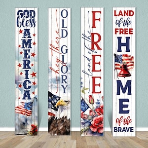 May include: Four wooden signs with patriotic themes. The signs feature the phrases "God Bless America", "Old Glory", "Land of the Free", and "Home of the Brave". Each sign has a red, white, and blue American flag design with additional imagery such as an eagle, flowers, and a bell.