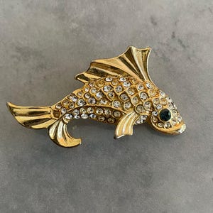 Vintage Fish Pin with Clear Stones Body  and Green Eyes Gold Tone