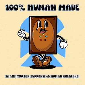 May include: A cartoon character shaped like a brown rectangular card with a smiling face, arms, and legs, wearing white gloves and brown shoes. The text 100% HUMAN MADE appears at the top, and THANK YOU FOR SUPPORTING HUMAN CREATORS at the bottom.