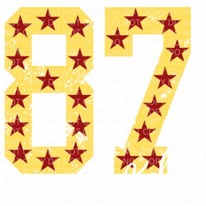 May include: The numbers 87 are displayed in a yellow and red color scheme. The numbers are made up of red stars on a yellow background. The background is a white surface.