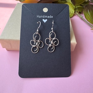 Handmade Wire Wrapped Silver Swirl Earrings. Metal Statement earrings. Artisan Crafted Christmas Gift. Everyday Earrings.