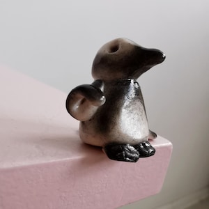 Figurine de pingouin miniature inspirée des animaux