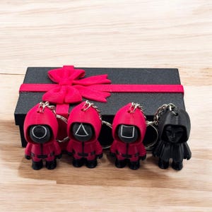 Collectors Set Circle, Triangle, Square and Front Man with Coffin Gift Container - Keychains
