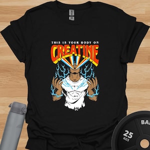 May include: Black t-shirt with a graphic of a person with lightning bolts coming from their eyes. The text "This is your body on Creatine" is above the graphic.