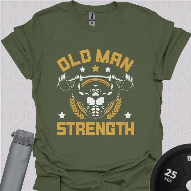 May include: A green t-shirt with a yellow graphic of a gorilla lifting weights. The text "Old Man Strength" is printed in yellow on the shirt.