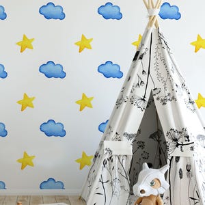 Dreamy Skies Stars and Clouds in Harmony Wallpaper