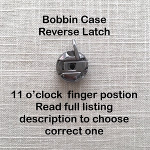 May include: A silver bobbin case with a reverse latch. The bobbin case has a finger position at 11 o'clock. Read the full listing description to choose the correct one.