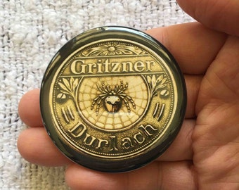 Gritzner Treadle Sewing Machine Spider and Web Emblem Pocket Mirror, Magnet or Pin