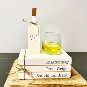 Faux wine, mini wine glass, book stack, tiered tray decor, White wines