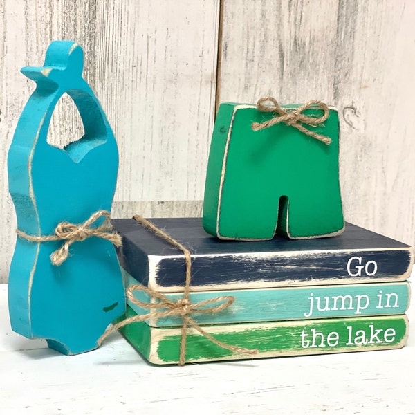 Wooden bathing suits and Go jump in the lake book stack for cottage decor, Lake house tiered tray, Rustic fish shelf sitter