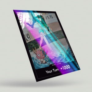 May include: A black and white illustration of a cartoon character with a straw hat and a red and white crab on a blue and white background. The text "DON!! CARD Your Turn +1000" is at the bottom of the image.