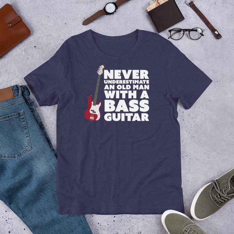 Never Underestimate An Old Man With A Bass Guitar T-Shirt | Guitar Tshirts | Bass Shirt | Funny Music Shirts | Bass Player Shirt | Gift For Bassist | Bassist Shirt | Bass Player | Heather Blue