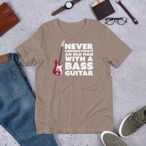 Never Underestimate An Old Man With A Bass Guitar T-Shirt | Guitar Tshirts | Bass Shirt | Funny Music Shirts | Bass Player Shirt | Gift For Bassist | Bassist Shirt | Bass Player | Pebble Brown