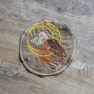 May include: A set of three ceramic mugs with a speckled, matte finish. The mugs are in shades of cream, light gray, and dark gray. Each mug has a simple, minimalist design and a rounded handle.